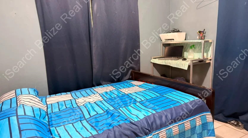 House for Sale in Lord's Bank Belize featuring a 3-bedroom concrete home and separate 1-bedroom rental home on one lot.