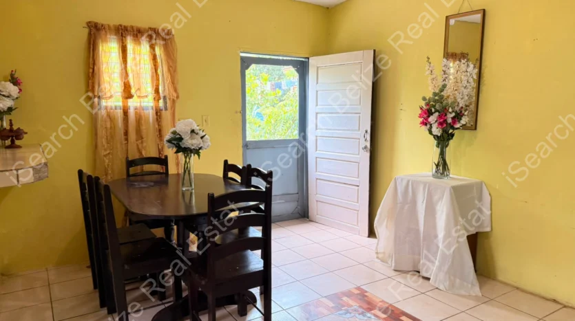House for Sale in Lord's Bank Belize featuring a 3-bedroom concrete home and separate 1-bedroom rental home on one lot.