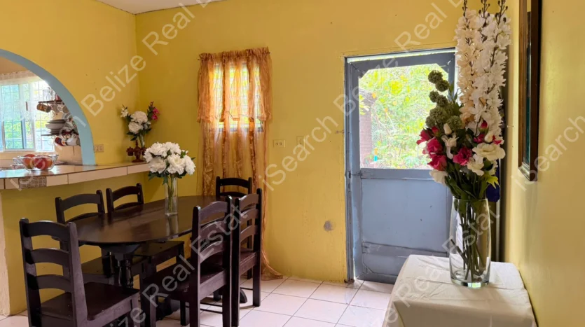 House for Sale in Lord's Bank Belize featuring a 3-bedroom concrete home and separate 1-bedroom rental home on one lot.