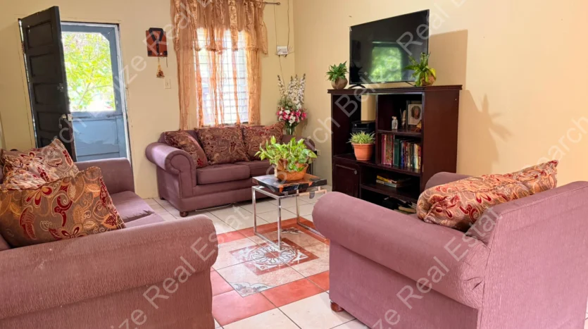 House for Sale in Lord's Bank Belize featuring a 3-bedroom concrete home and separate 1-bedroom rental home on one lot.
