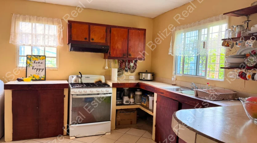 House for Sale in Lord's Bank Belize featuring a 3-bedroom concrete home and separate 1-bedroom rental home on one lot.