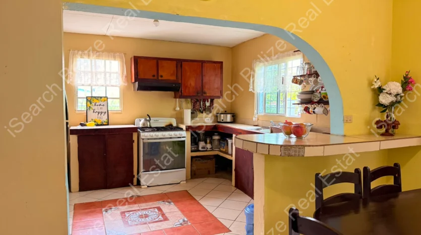House for Sale in Lord's Bank Belize featuring a 3-bedroom concrete home and separate 1-bedroom rental home on one lot.