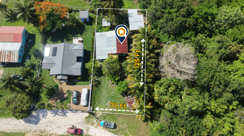 House for Sale in Lord's Bank Belize featuring a 3-bedroom concrete home and separate 1-bedroom rental home on one lot.
