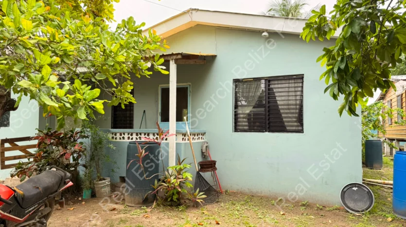 House for Sale in Lord's Bank Belize featuring a 3-bedroom concrete home and separate 1-bedroom rental home on one lot.