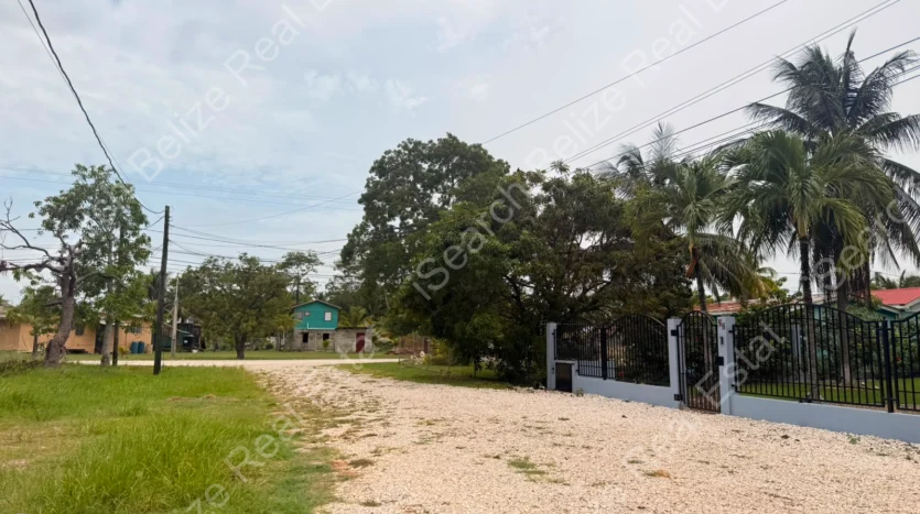 House for Sale in Lord's Bank Belize featuring a 3-bedroom concrete home and separate 1-bedroom rental home on one lot.