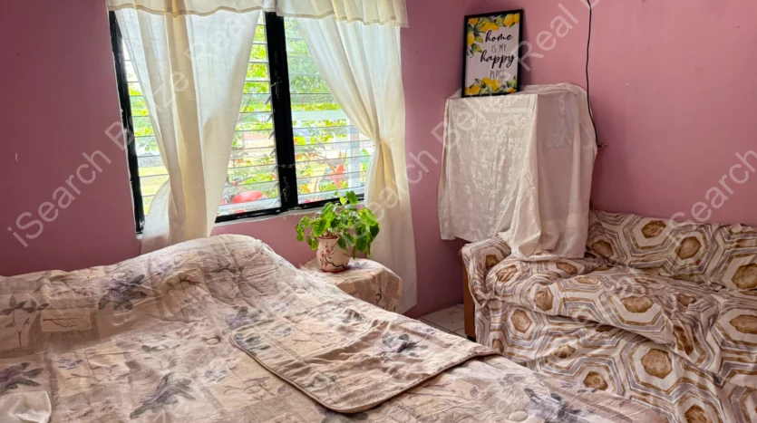 House for Sale in Lord's Bank Belize featuring a 3-bedroom concrete home and separate 1-bedroom rental home on one lot.