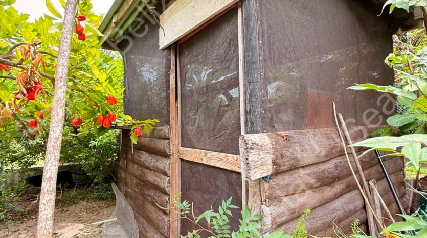 House for Sale in Lord's Bank Belize featuring a 3-bedroom concrete home and separate 1-bedroom rental home on one lot.