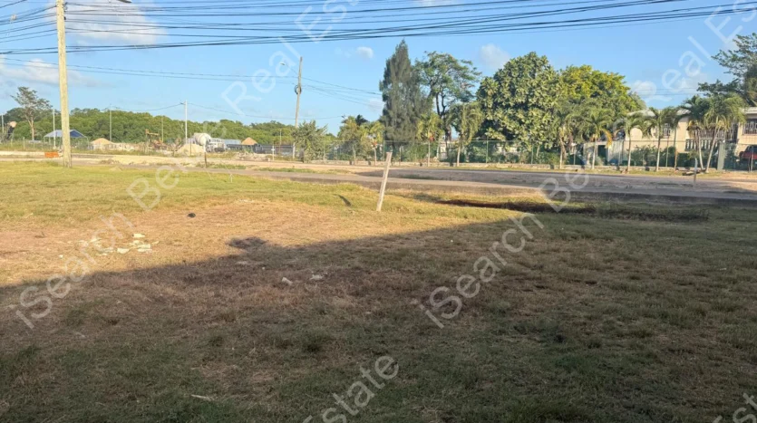 Cleared land for sale on George Price Highway Belize with 152 feet of highway frontage.