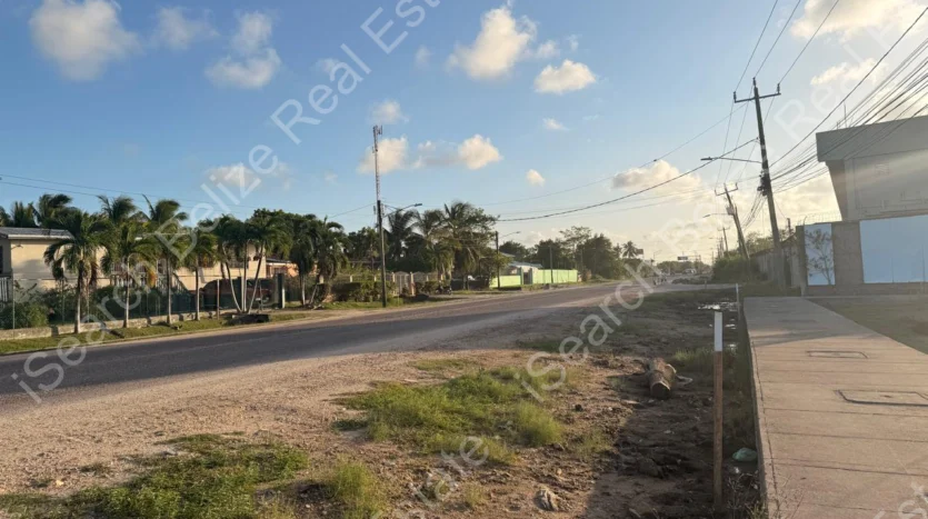 Cleared land for sale on George Price Highway Belize with 152 feet of highway frontage.
