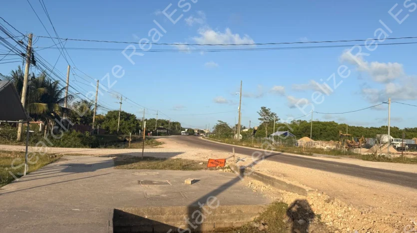 Cleared land for sale on George Price Highway Belize with 152 feet of highway frontage.