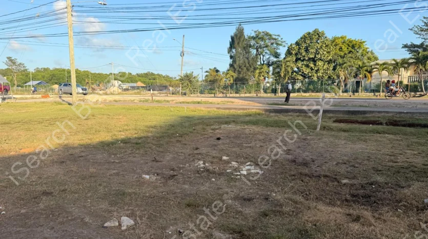 Cleared land for sale on George Price Highway Belize with 152 feet of highway frontage.