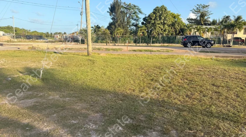 Cleared land for sale on George Price Highway Belize with 152 feet of highway frontage.